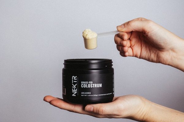 Hand scooping NEKTR colostrum powder